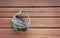 Old wicker basket hanging on wooden wall