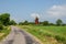 Old windmill by roadside