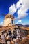 Old windmill ruins on a hill in Santorini island