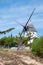 Old windmill on sand dunes in island of Noirmoutier Vendee France