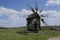 Old windmill. Ukrainian mill of the nineteenth century. Summer landscape, sunshine. Village Pirogovo