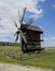 Old windmill. Ukrainian mill of the nineteenth century. Summer landscape, sunshine. Village Pirogovo