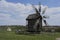 Old windmill. Ukrainian mill of the nineteenth century. Summer landscape, sunshine. Village Pirogovo