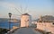 Old windmill and view of Parikia, Paros island, Greece