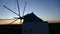 Old windmill on a windy hill in Portugal