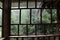 old window and downpour behind