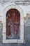 An old window facing the harbour on the Greek island of Kastellorizo.