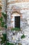 Old window grille of a ruined castle