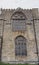 Old window on the historic medieval cartmel priory in cumbria now the parish church of st micheal and mary