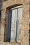 Old window of ruined home in Kefalos