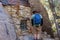 Old window and stone wall at Eagle Cliff Mine cabin with a hiker at Joshua Tree National Park, California