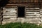 Old window and wooden cottage, aged cottage, traveling in sunny