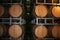 Old wine barrels in a wine cellar. Stacked Wine barrels at the winery. Whisky casks in old cellar.