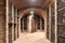 Old wine cellar with wine storage cases and open vintage wooden doors