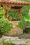 Old wishing well among ivy leaves