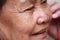 Old woman closes one\'s eyes