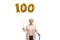 Old woman with a golden number hundred balloon and a walking cane