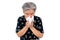 An old woman have a cold, uses a tissue to cover her mouth when coughing and sneezing