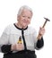 Old woman holding hammer and pliers