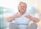 Old woman Meditating against bright background
