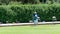 Old woman playing lawn bowling in Golden Gate Park