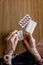 Old woman preparing her pills with medical remote assistance button on the wrist