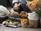 The old woman puts mushrooms in autumn on the street market