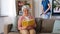 Old woman reading book and housekeeper at home