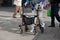 Old woman with rollator in city