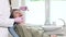 Old woman sitting in dental chair and having routine dental checkup