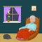 Old woman sitting in a rocking chair in a room at night
