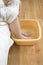 Old woman soaking feet in a bowl of water.