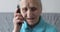 Old woman talking on phone.