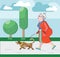 Old woman walks with dog in park. Pensioner walks with dog. Graceful grandma. Pensioner free time. Old woman in profile. Pension