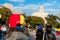 Old woman wearing hat with venezuelan flag and country name in Barcelona city main square during march for regime change