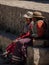 Old women in andes town village Achoma wearing traditional indigenous handwoven colorful dress costume Colca Canyon Peru