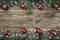 Old wood background with fir branches adorned with baubles. Space for text. Christmas card. Top view. Xmas. Snow effect