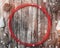 Old wood background, fir cones around a red circle. Holiday space for winter, xmas, New Year and Christmas holidays.