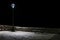 Old wood bench illuminated by a street lamp