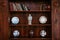 Old wood bookshelf with Chinaware plates, Vase and jar