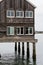 Old Wood Building on Stilts in Water