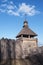 Old wood rustic church building and wooden fence against blue sk