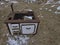 An old wood stove in the open on a meadow