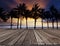 Old wood terrace on sea beach with coconuts tree and beautiful d