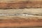 Old wood texture with natural crack patterns, brown background
