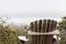 Old Wooden Adirondack Chair on Deck, Overlooking Saltwater Marsh