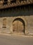 Old wooden arch door in Arreau, France.