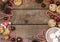 Old Wooden Background with Christmas Decorations Cookies with Chocolate Drops and Cup of Cocoa with Marshmellows Red and Brown