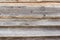 Old wooden background with horizontal boards, rough rough boards nailed with large nails