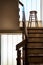 Old wooden Bar Stool in a Wooden Staircase with Handrailing in an Old house